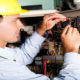 male electrician testing industrial machine